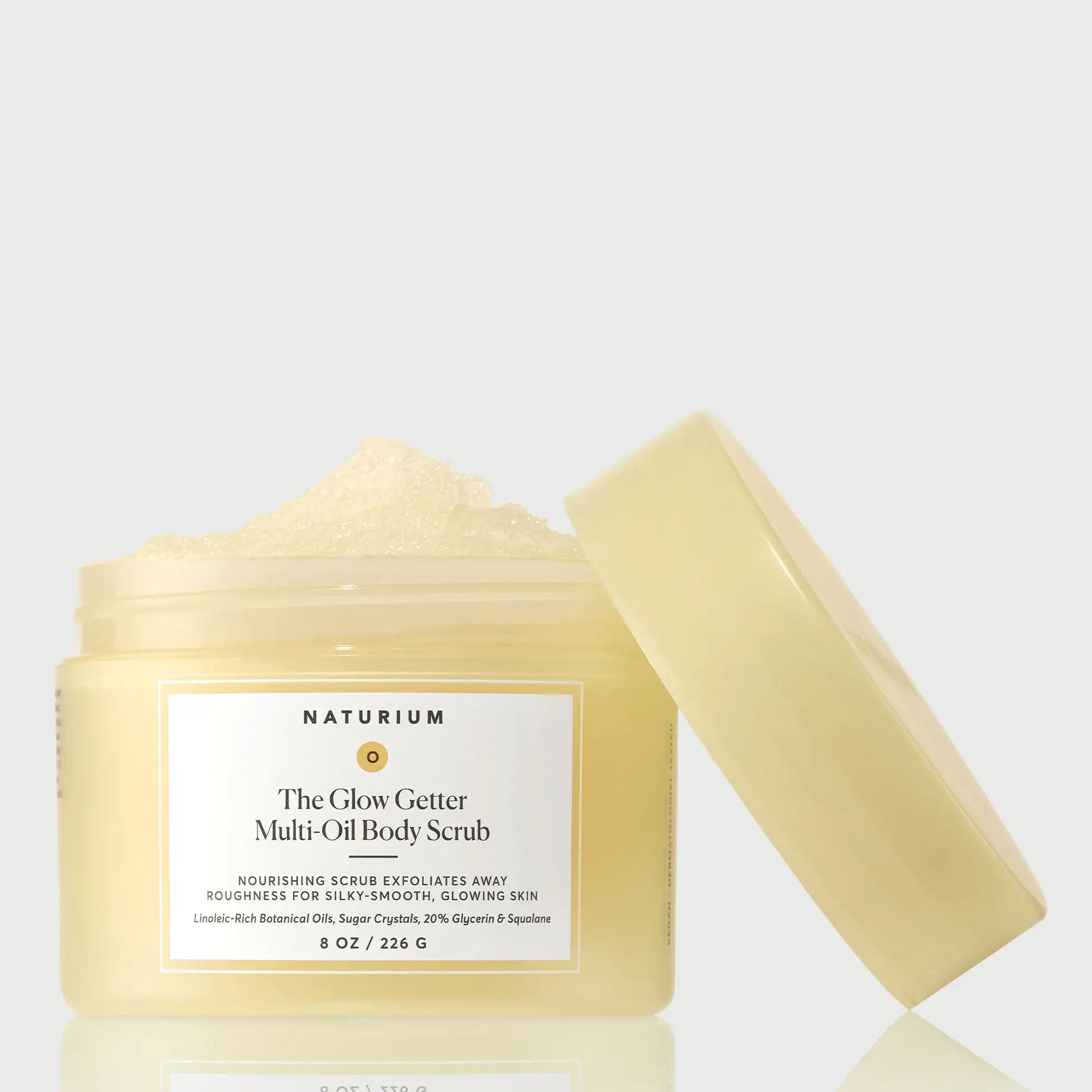the-glow-getter-multi-oil-body-scrub-j1 NATR-40028-GlowGetter-Multi-Oil-Body-Scrub-Front-CapOff-bonebkgd.webp